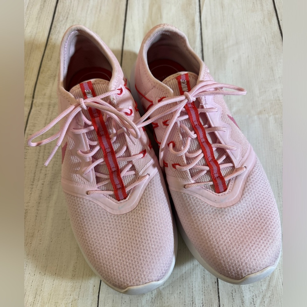 Nike Pink Athletic Shoes with Red Accents